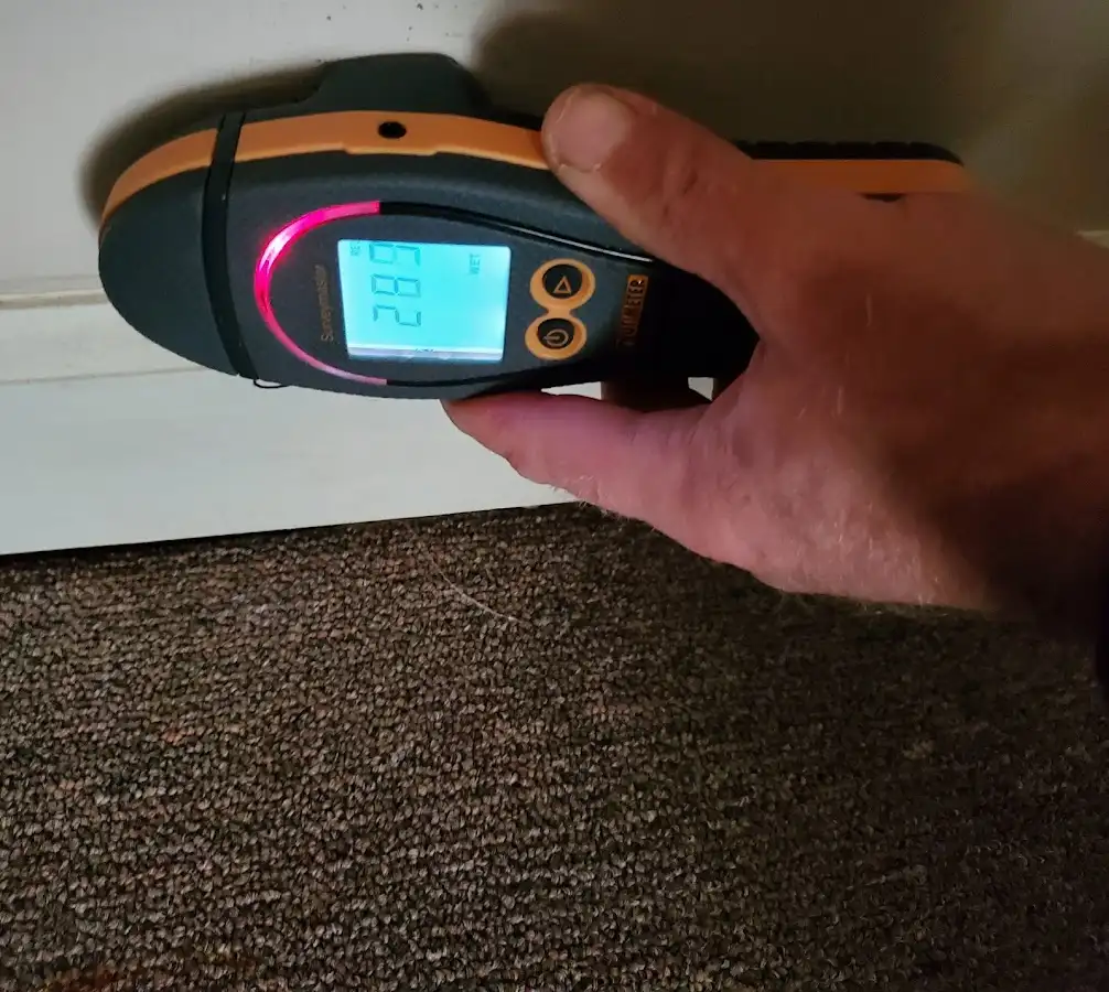 Moisture detection at baseboard during Storm Damage Restoration in McKeesport